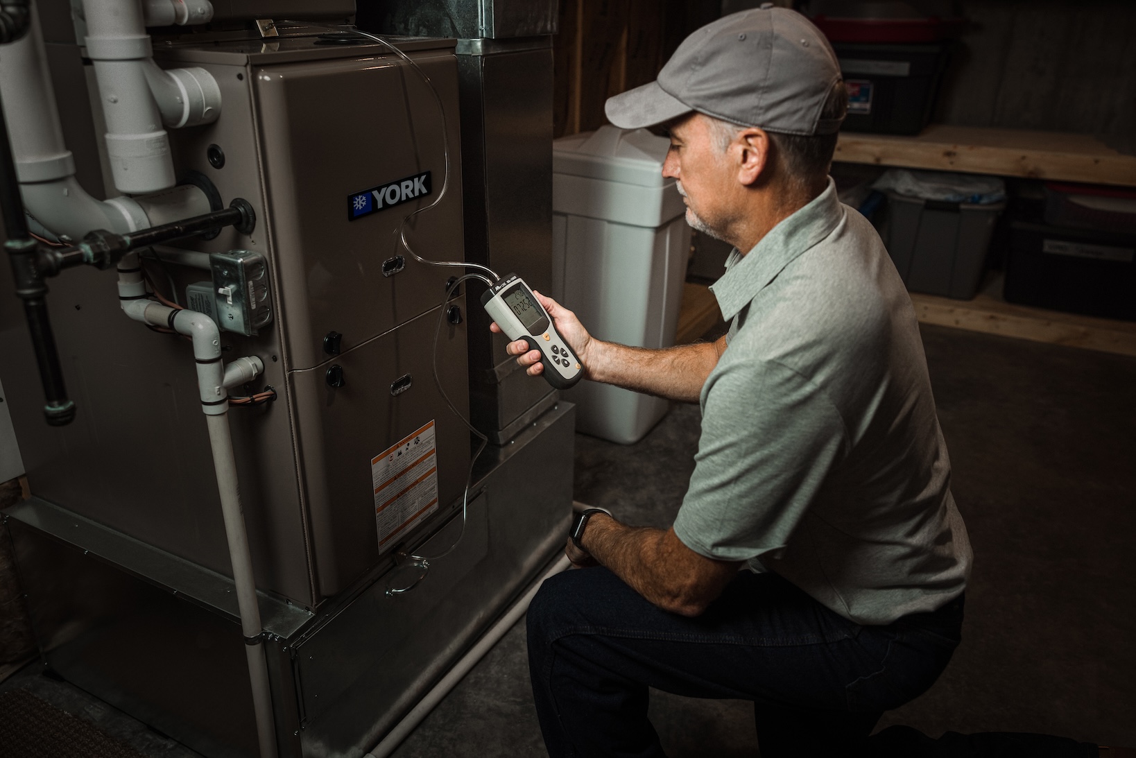 HVAC technician servicing a furnace
